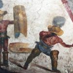 Arqueólogos revelam afresco de gladiadores em Pompeia