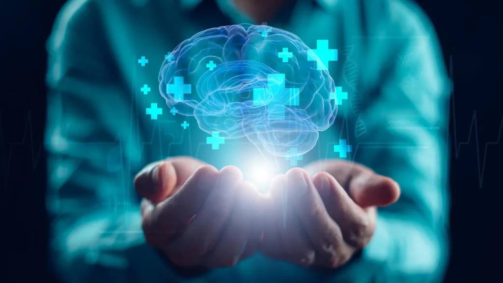 mãos segurando um holograma de um cérebro